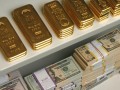 gold-bars-and-us-dollar-bills