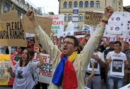 Protesters shout slogans during a demonstration against the opening of the Rosia Montana open cast gold mine in Bucharest