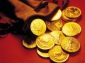 Gold coins spilled from a leather sack.